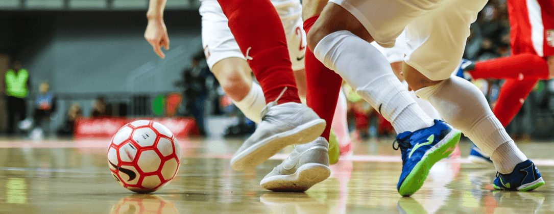 closeup of futsal teams competing during a game