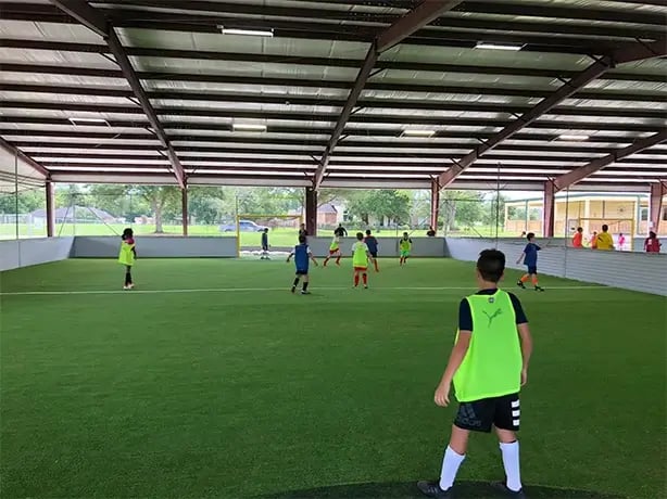 Soccer club practicing on indoor field