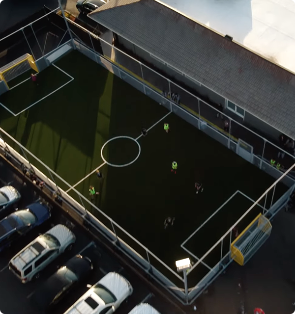 Aerial photo of a completed 5v5 modular mini-pitch installed within a neighborhood park.